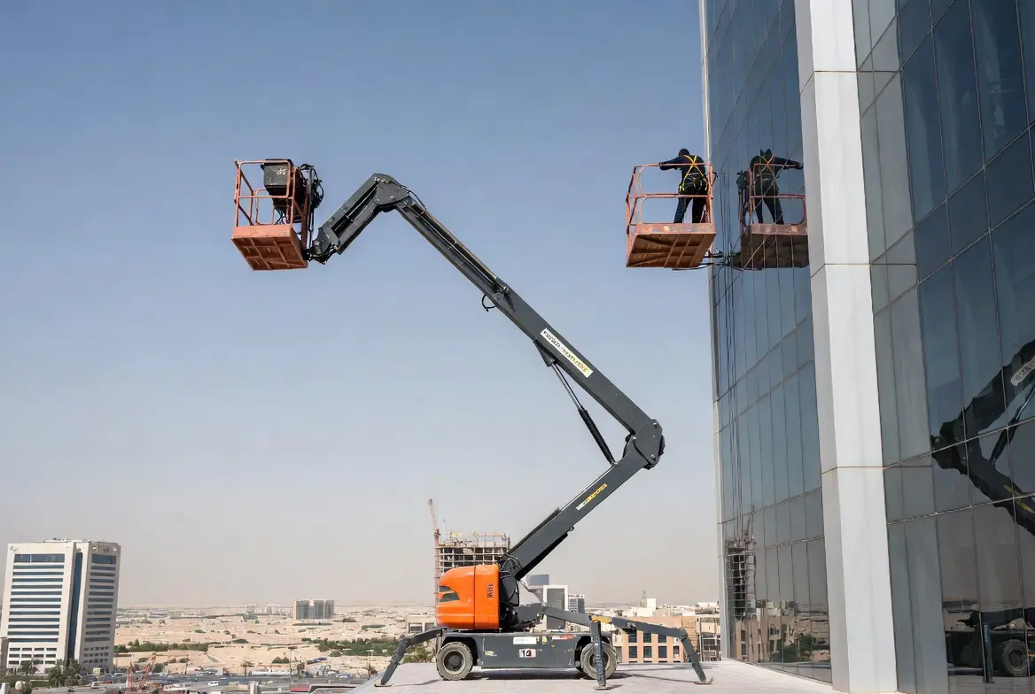 20m articulated manlift working on luxury hotel glass facade in Riyadh Olaya